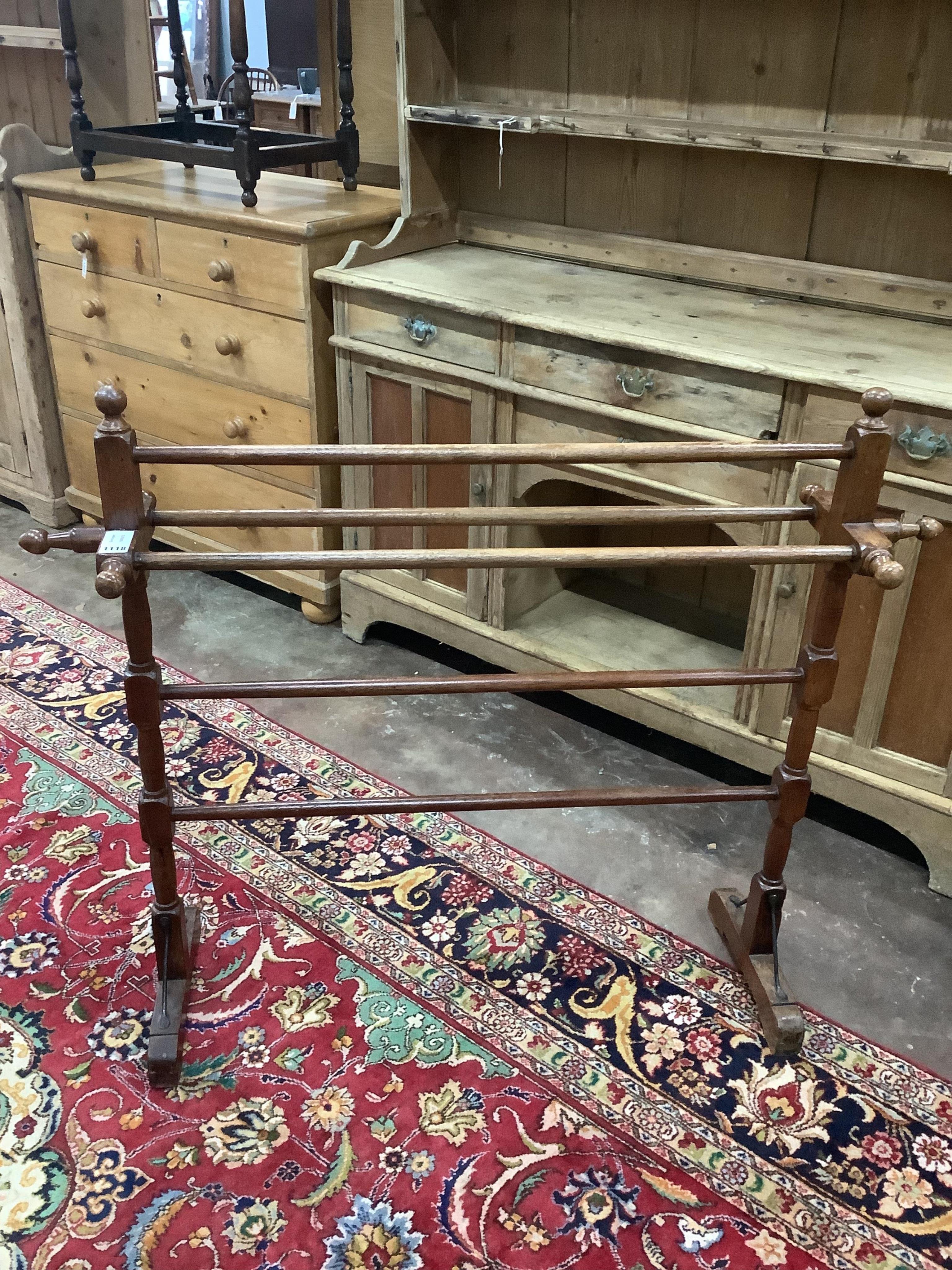 An Anglo Indian teak towel rail, width 115cm, height 96cm. Condition - fair